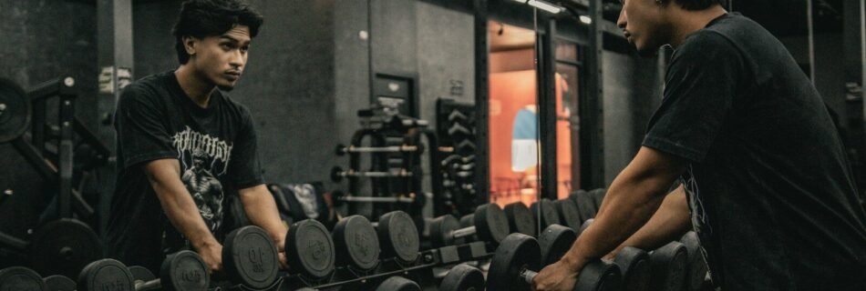 A couple of men working out in a gym