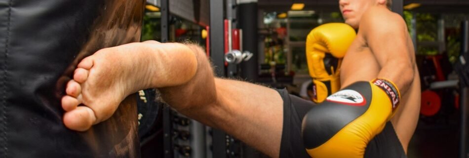 woman in black tank top and black shorts doing push up