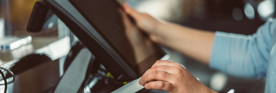 a person is using a tablet on a conveyor belt