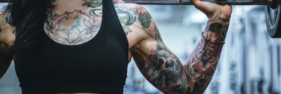woman carrying barbell